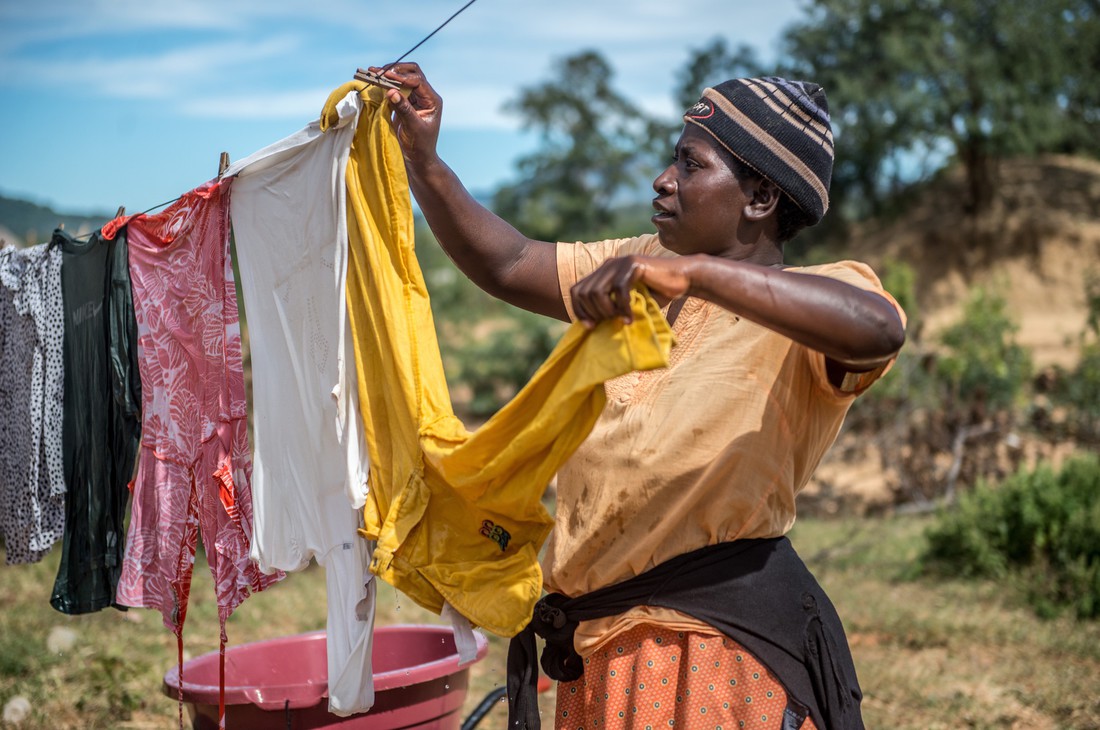 Melody hanging up her laundry in Zimbabwe