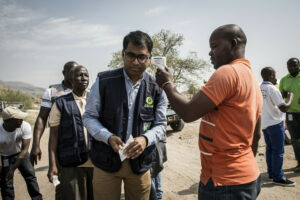 Danny Sriskandarajah (CEO of Oxfam GB) gets his temperature measured at an Ebola security check point on March 06, 2019 in Tchomia, DRC